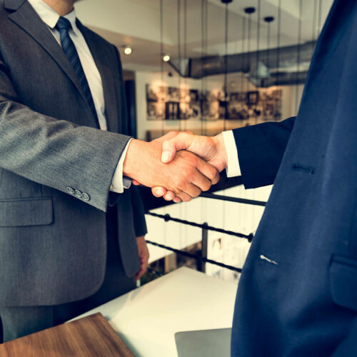 corporate-business-men-handshake-meeting-concept-PHT3ER2