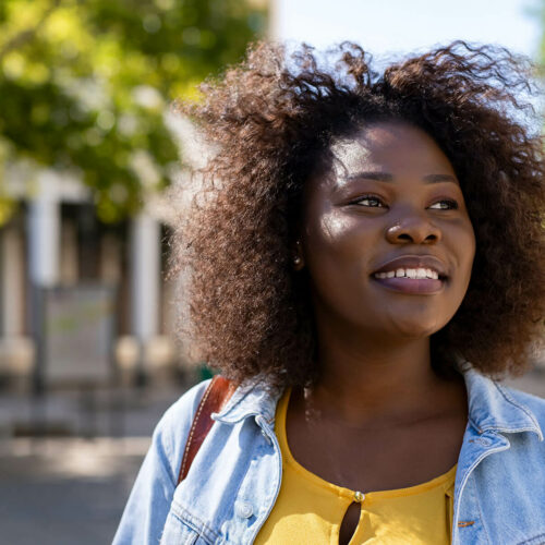 happy-black-woman-thinking-CES3A2U